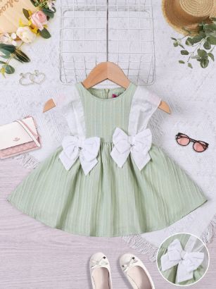 صورة فستان بناتي صيفي أخضر مع فيونكتين بيضاء – موديل 12