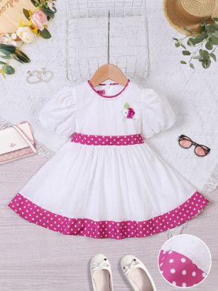صورة فستان بناتي صيفي أبيض بنقاط وردية وزخارف جميلة – موديل 5