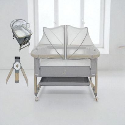 صورة سرير أطفال مع ناموسية وحامل هزاز