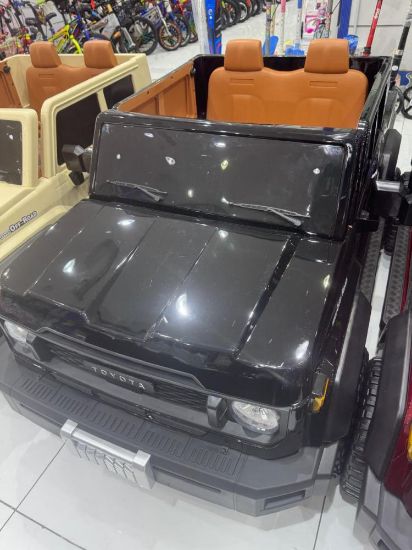 صورة سيارة أطفال كهربائية بتصميم فخم ولون أنيق