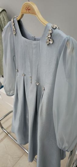 صورة فستان سماوي كم طويل ترتر