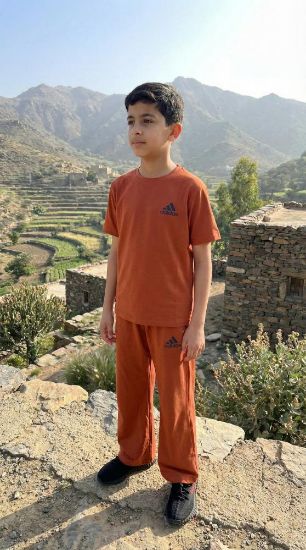 صورة طقم "أورانج سبورتس" من adi